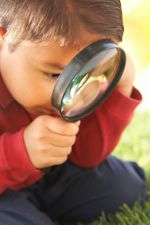 boy with magnifying glass boy with magnifying glass