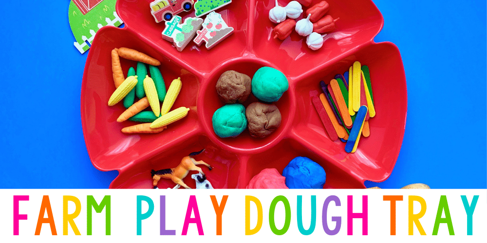a red tray with six compartments holding playdough and farm accessories