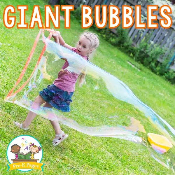 girl using a giant bubble wand