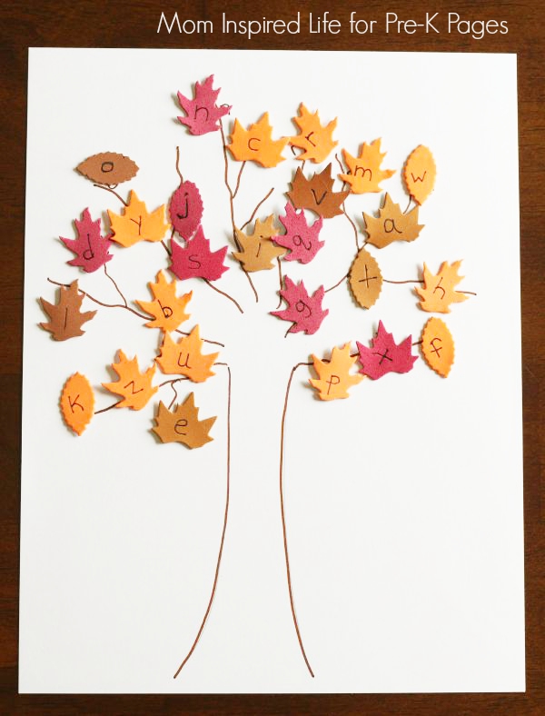 Tree on paper with fall leaves with letters on them taped to the tree