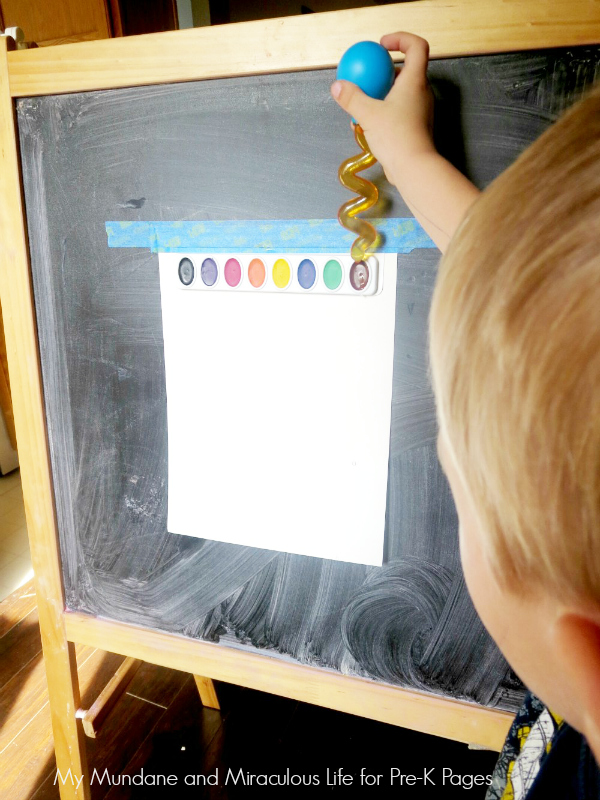 rain art materials taped to chalkboard