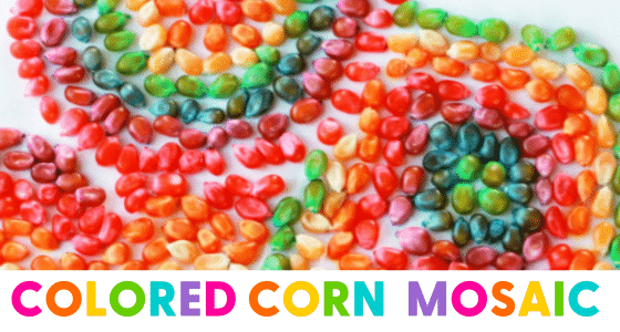 colored uncooked popcorn kernels glued to paper