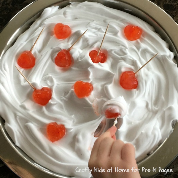 Valentine Science Experiment With Ice Hearts bowl of shaving foam with heart shaped ice