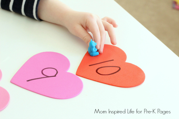preschooler playing valentines day counting game