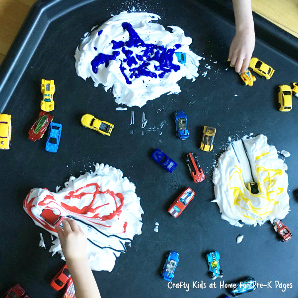 cars playing in shaving cream with paint
