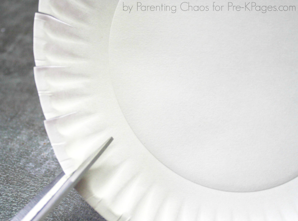 scissors cutting paper plate