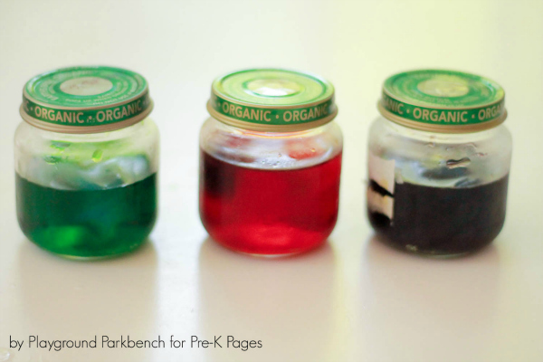 three jars of colored water for color mixing activity