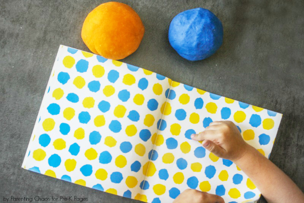 little blue little yellow book and two balls of playdough