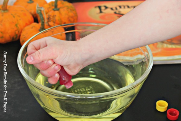 food coloring being added to bowl