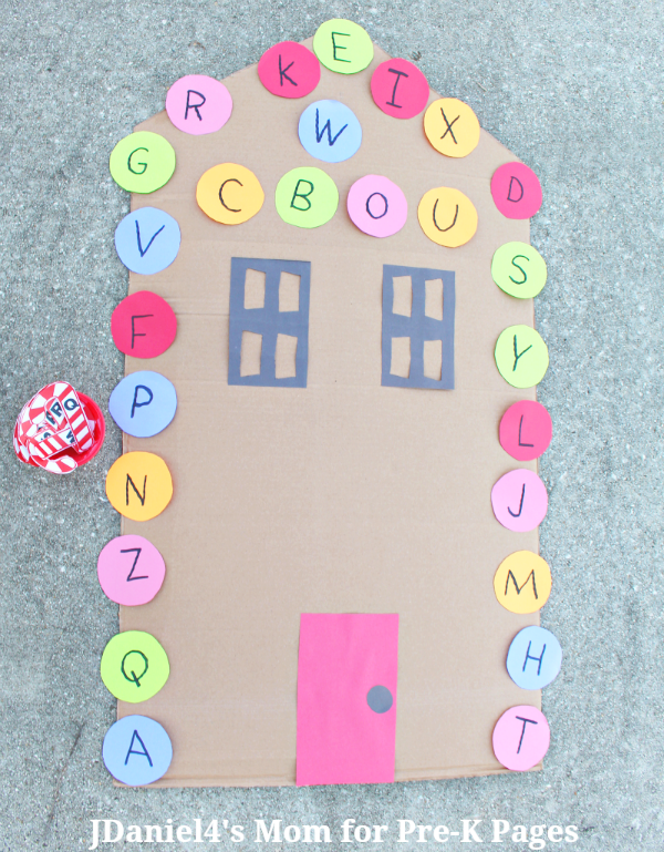 large gingerbread house with letters on it