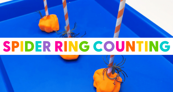 Spider rings placed on a straw stuck in a lump of play dough
