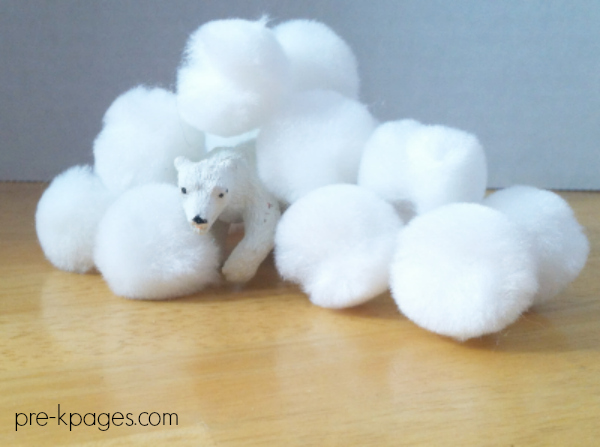 polar bear figurine under cotton balls for building STEM