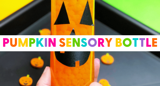 a water bottle filled with orange water beads. The bottle has a jack o lantern face on the front.