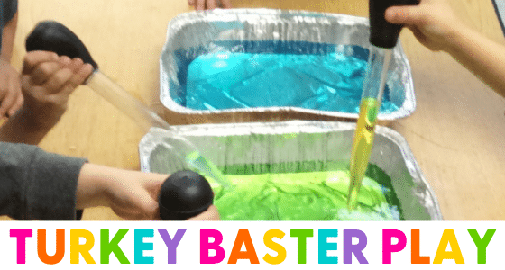 children playing with colorful water using turkey basters