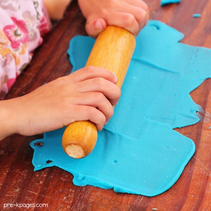 Rolling Play Doh with rolling pin