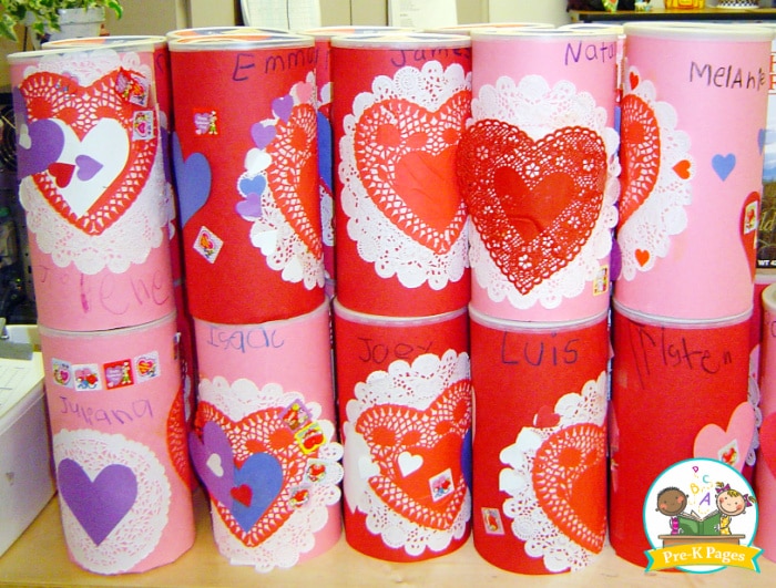 oatmeal containers used as card holders and decorated for valentine's day theme