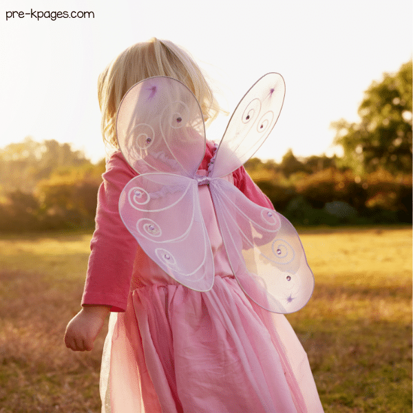 little girl wearing a butterfly costume with wings