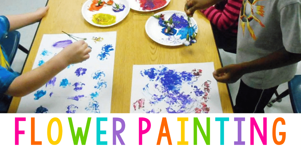 hands of children holding flowers and painting with the petals