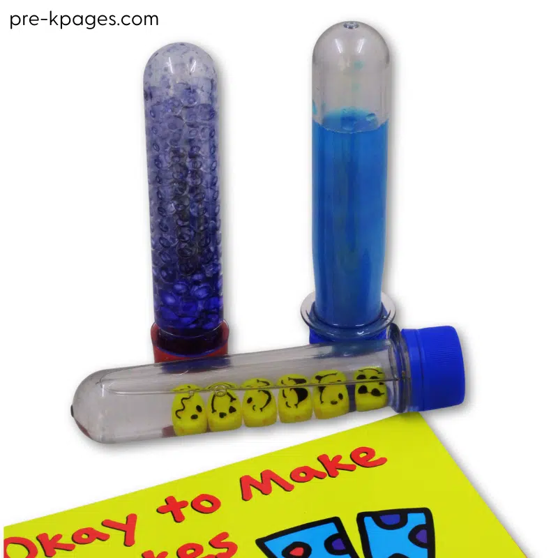 3 plastic test tubes containing different things