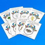 a set of cards displayed on tabletop featuring snowmen