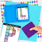 hand holding one purple magna tile